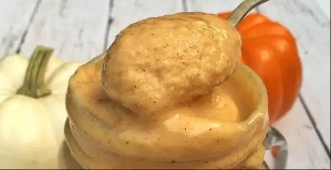 Healthy pumpkin pie smoothie in a glass with pumpkin and spices