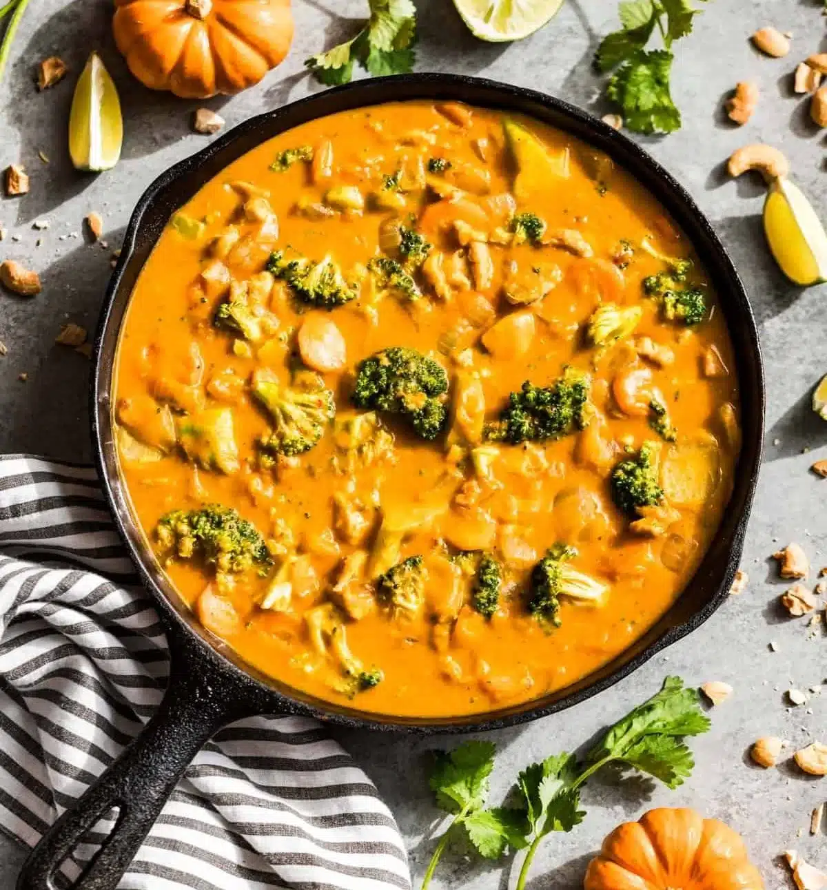 Delicious bowl of Pumpkin Curry garnished with fresh herbs.